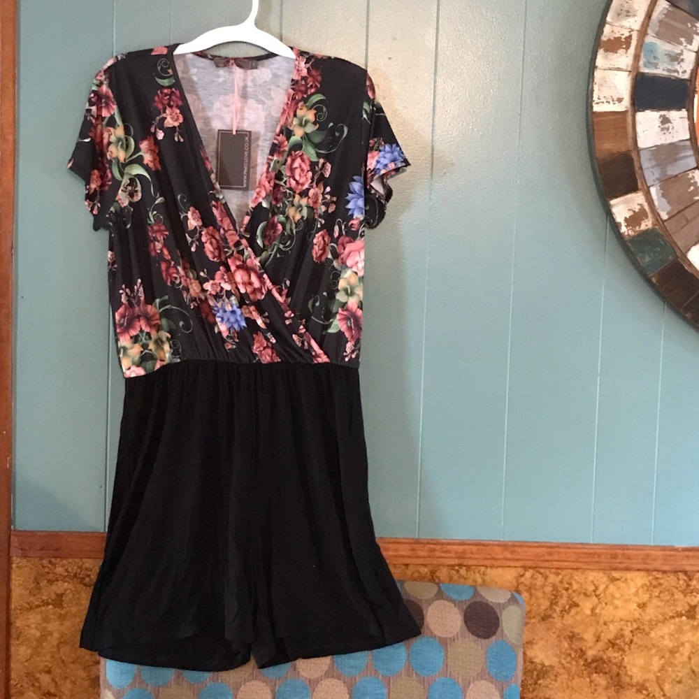 NWT floral romper; solid black bottom